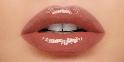 Close up of 80s Rose Brown Lip gloss shade worn on lips