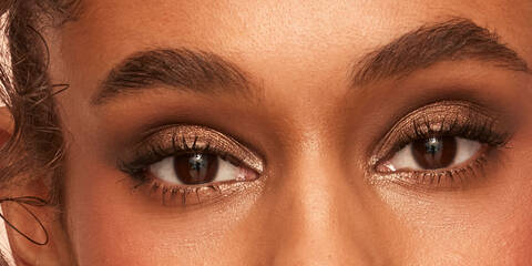 Close up of a brown smokey eyeshadow look on brown eyes and dark skin