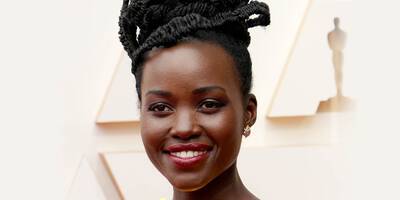Lupita Nyong’o Gold Eye Makeup and Red Lipstick on the red carpet of the 2022 Oscars academy awards