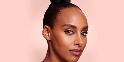 Creative Inner Corner Eyeliner Look with Long Lashes