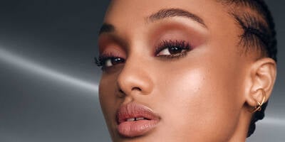 Model wearing volumizing mascaras