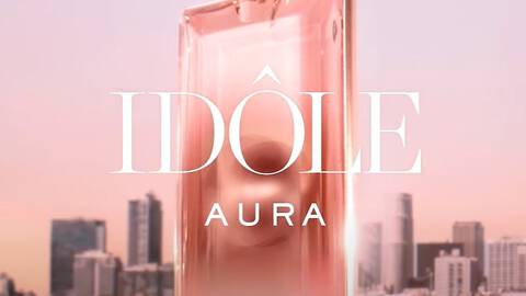 Lancome Idole Aura Eau de Parfum against a city scape background.