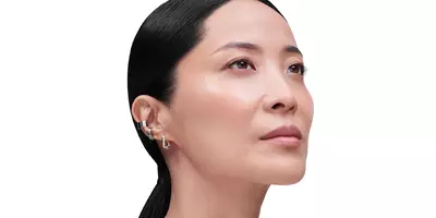 Mature east Asian woman with collagen loss looking upwards