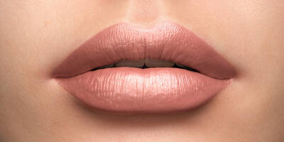 Cool Pinky Nude Lipstick worn on a pale porcelain light skin tone
