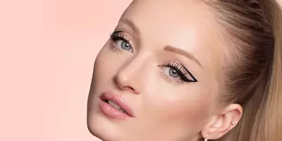 Creative Graphic Eyeliner Look with Long Lashes
