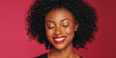 Bronzed Makeup Look with a Coral Red Lip on Dark Skin