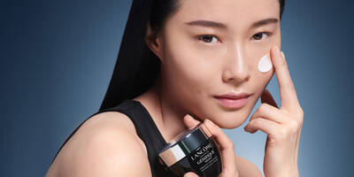 Woman applying moisturizer to care for dry skin in winter