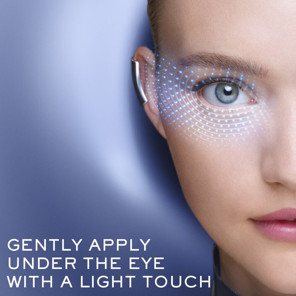 Gently apply Genifique Ultimate Eye Cream under the eye with a light touch 
