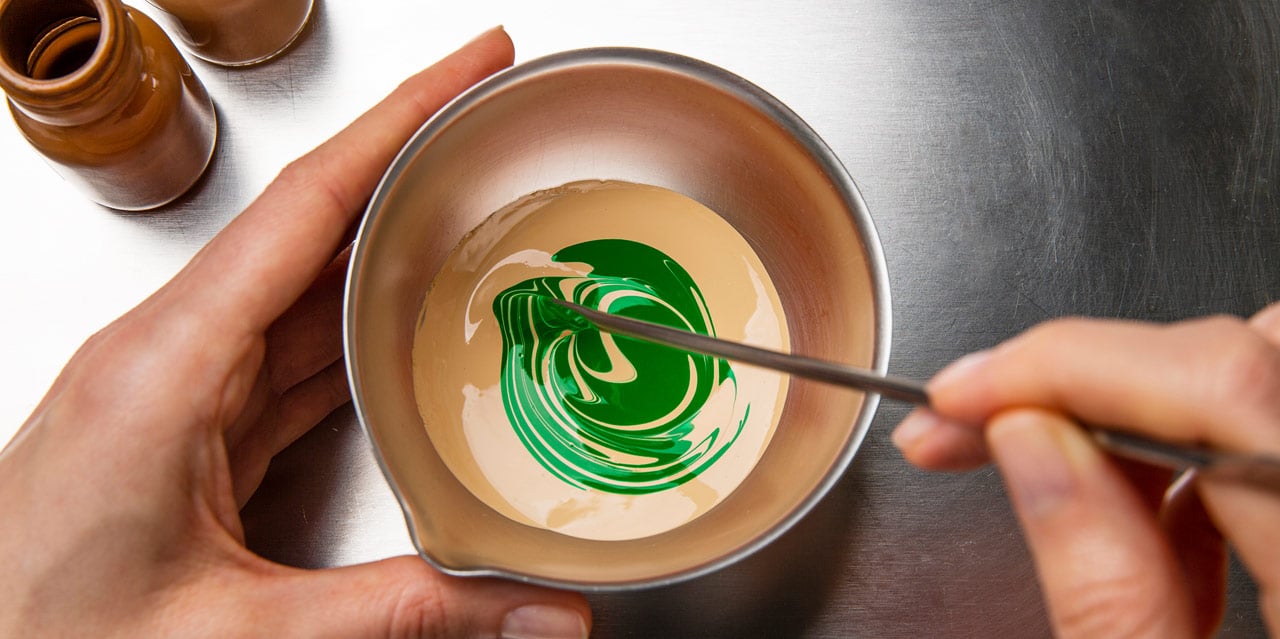 Green pigment blended into foundation for olive skin to balance out orange, yellow and ashy tones